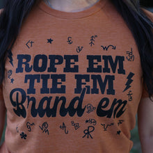 Load image into Gallery viewer, FestiviTees Women - Apparel - Shirts - T-Shirts Rope &#39;Em Tie &#39;Em Brand &#39;Em Soft Graphic Tee