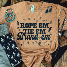 Load image into Gallery viewer, FestiviTees Women - Apparel - Shirts - T-Shirts Rope &#39;Em Tie &#39;Em Brand &#39;Em Soft Graphic Tee