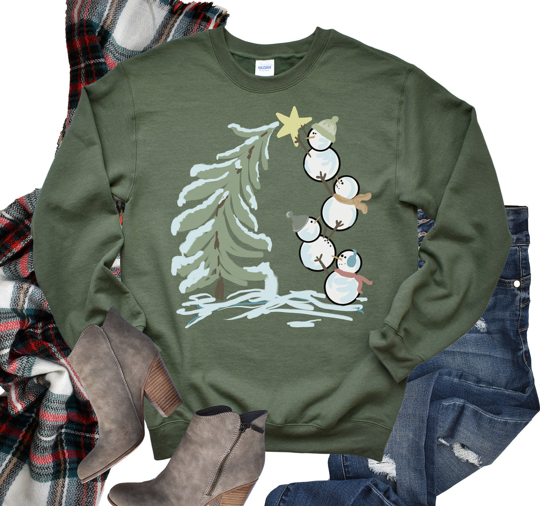 Snowman putting on a Star Graphic Tee